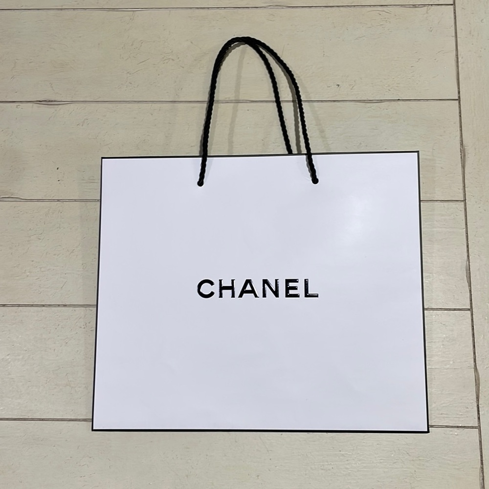 Chanel white shopping bag.